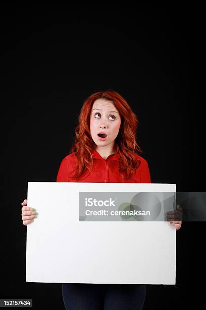 Thinking Redhead Holding Pancarte Stock Photo - Download Image Now - Adult, Advertisement, Announcement Message
