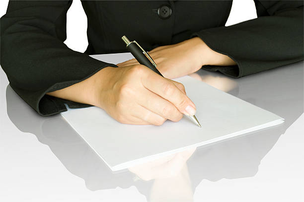 istock women keep pen and write on the white page 152158017
