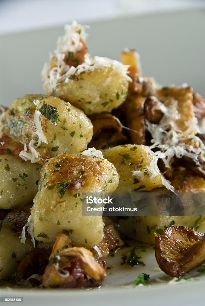 Gnocchi with mushrooms Gnocchi with chanterelle mushrooms and parmesan cheese Appetizer Stock Photo