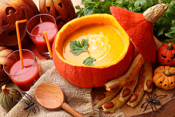 Pumpkin Soup Contained Within A Hollowed Pumpkin Stock Photo - Download Image Now - Halloween, Pumpkin Soup, Soup - iStock