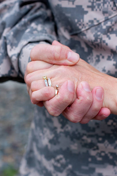 Soldier and wife's hands stock photo