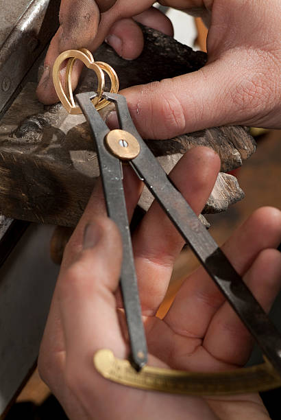 istock Goldsmith holds that with the tweezers a piece of 152160253