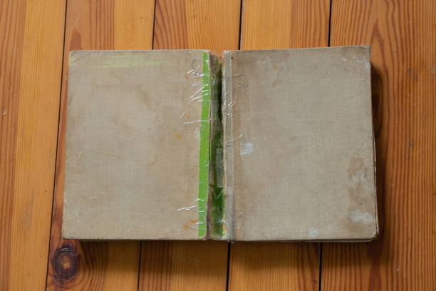 istock old books lie on a wooden table top view down 1521605120