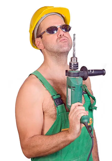 Serviceman with hand drill