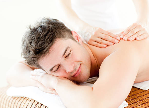 istock Relaxed young man receiving a back massage 152161191