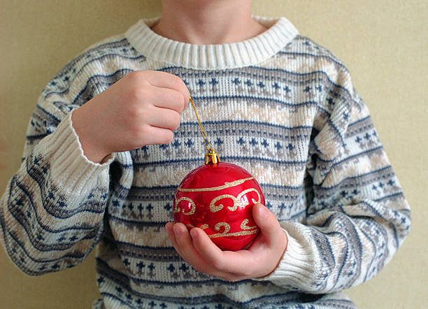 istock christmas sphere in child hands 152161594