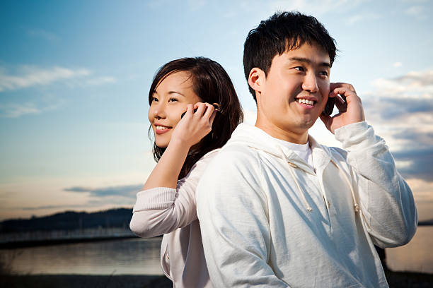 istock Asian couple on the phone 152161872