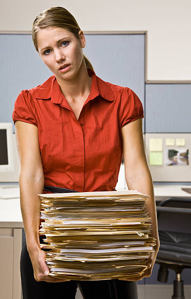 istock Businesswoman Carrying Stack of File Folders 152163441