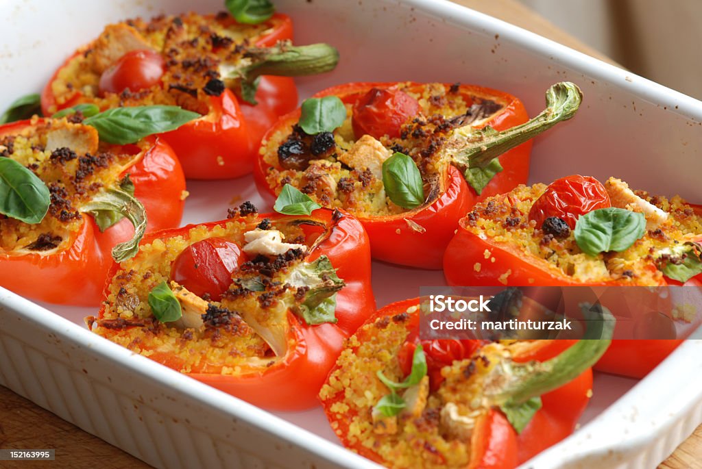 Roasted red peppers filled with couscous Red peppers filled with couscous  Stuffed Pepper Stock Photo