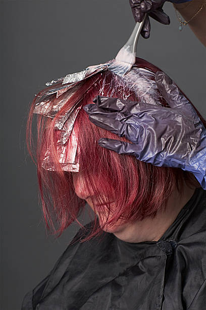 istock Hair stylist applying color 152164067