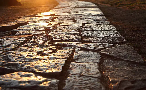 Ancient cobblestone pavement in the old town of Pula, Croatia