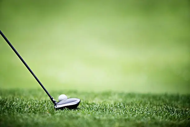 Photo of Shallow depth, golf ball and driver, driving range