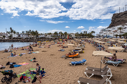 Gran Canaria, Spain - Feb 21, 2023: Seafront of Puerto de Mogan, Gran Canaria, Canary Islands, Spain. It is a most popular place with shopping facilities, restaurants and pubs.