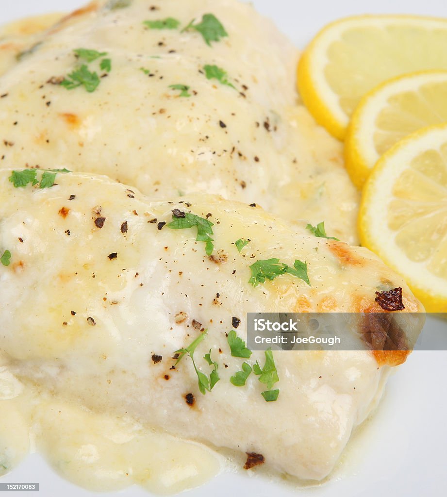 Baked Fish in Cheese Sauce Haddock fillet baked in a cheese sauce with gound pepper. Baked Stock Photo