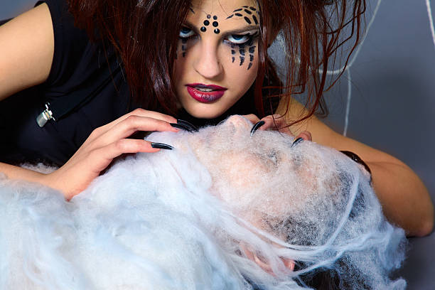 istock spider girl and victim 152171187