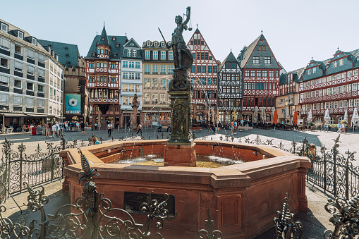 historic Römerberg with fountain and Statue of Justitia, Old town in Frankfurt am Main, Germany