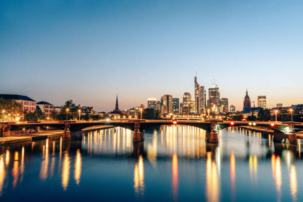 istock Frankfurt skyline at blue hour with bridge and motion blurred ship, Frankfurt am Main, Germany 1521715543