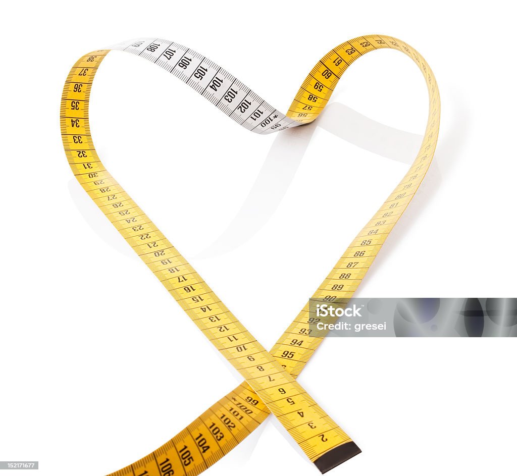 Measuring tape makes heart Measuring tape makes heart on a white background Heart Shape Stock Photo