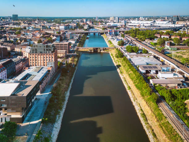 arial view on canal with Jungbusch quarter at one side and industrial area on the opposite site in Mannheim at sunny morning