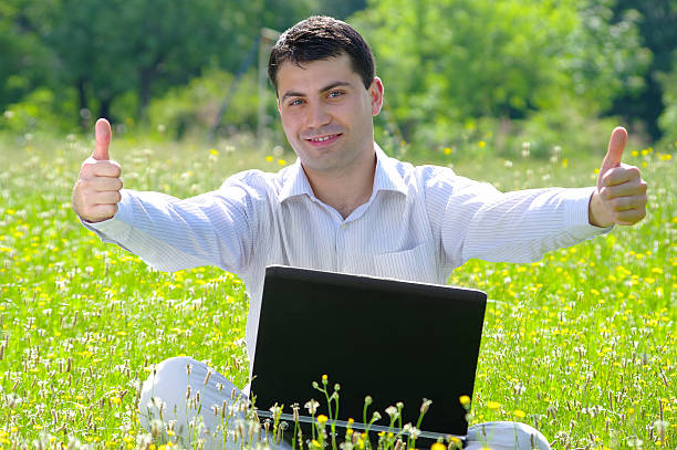 istock Young man working on a laptop in the nature 152172747