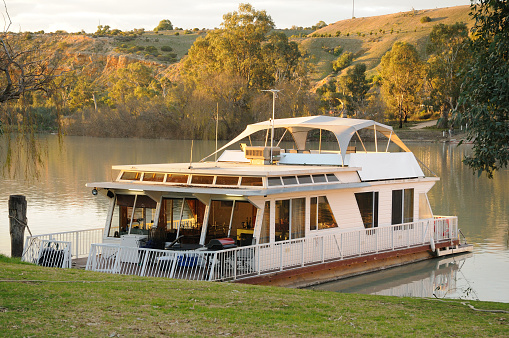 A Houseboat moored on the River Murray at Walker Flat in South Australia at sunset. Selective Focus. Others available in the series.