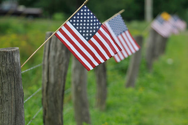 istock American Flags on Rural Fence post 152172888