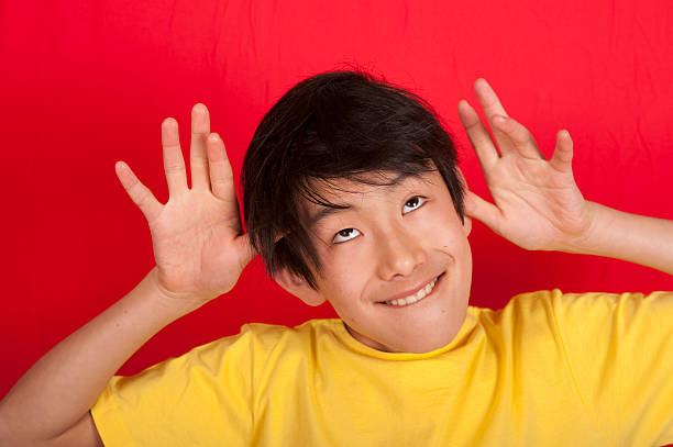istock Asian teenage boy making funny face 152173221