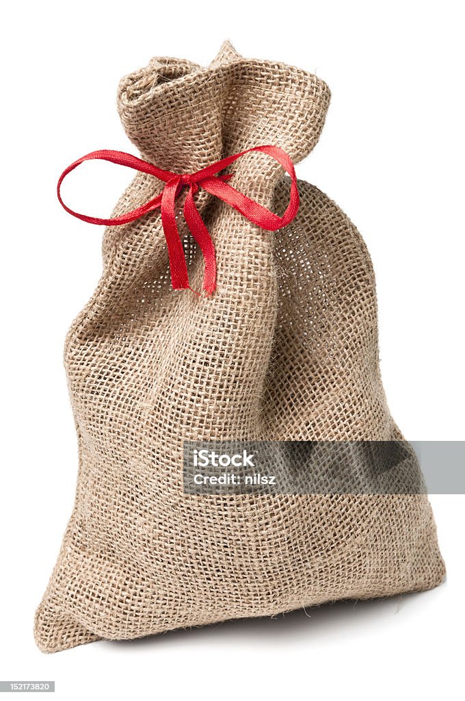 Sac toile de Jute cadeau avec ruban rouge - Photo de Beige libre de droits