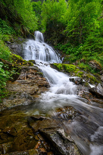 Beautiful waterfall in the mountains of the Alps. Silbertal, Montafon, Vorarlberg