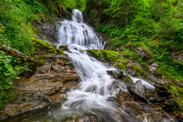 Beautiful waterfall in the mountains of the Alps. Silbertal, Montafon, Vorarlberg