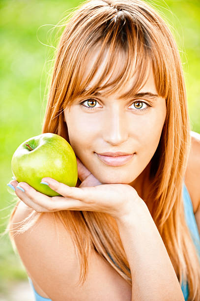 girl with apple stock photo