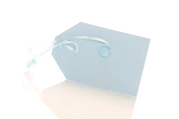 A baby blue tag on a white background with copy space.