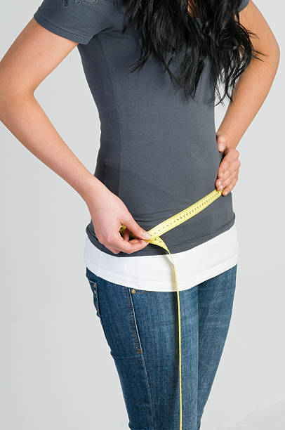 istock girl measuring her hip 152174990