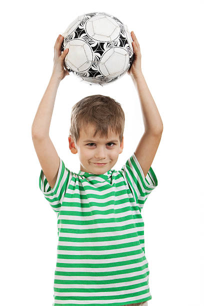 istock Boy holding soccer ball 152175013
