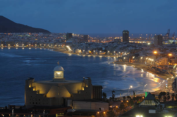 Las Palmas de Gran Canaria at night Las Palmas de Gran Canaria at night. Auditorio Alfredo Kraus in the foreground, Las Canteras beach in the background. grand canary stock pictures, royalty-free photos & images