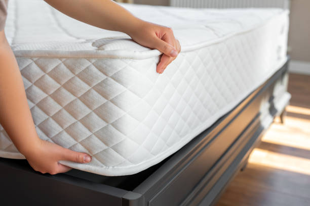 istock Woman choosing a mattress 1521768846