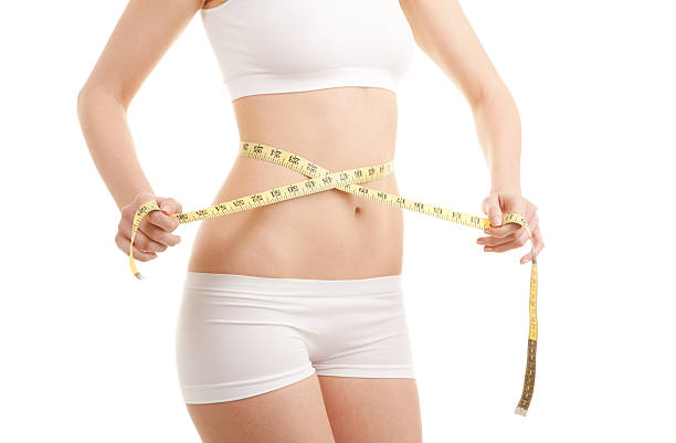 istock Athletic woman with measure tape 152177606