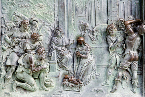 Pisa - detail from gate of cathedral Santa Maria assunta - birth of the Christ - bronze