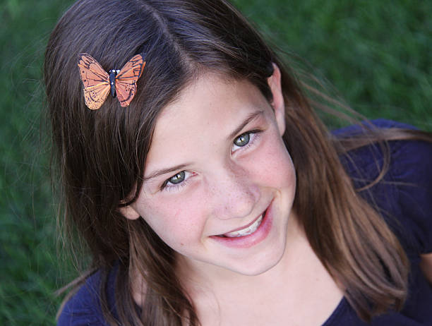 istock child with monarch butterfly in hair 152178265