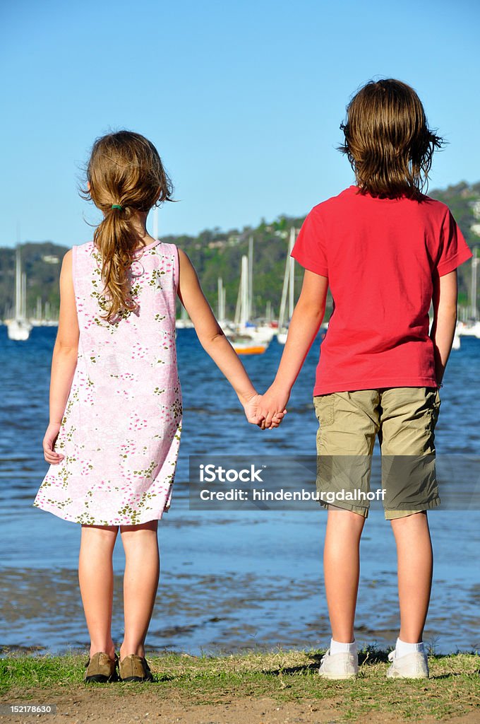 Best friends waiting Two best friends waiting at the waters edge, watching ships go by 4-5 Years Stock Photo