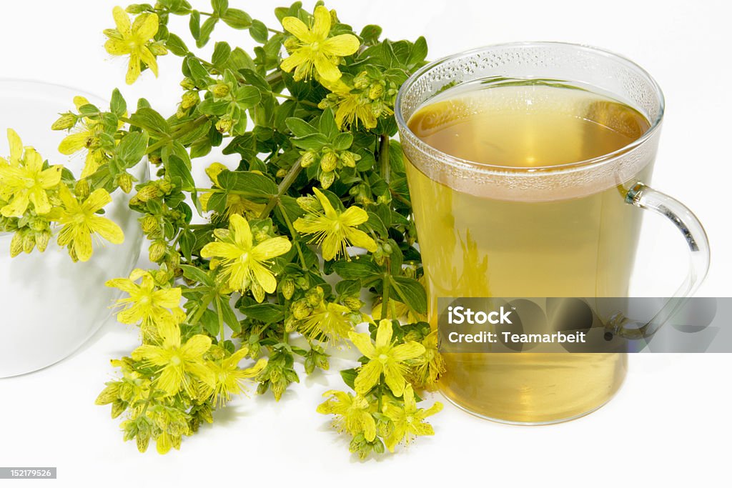 Saint-Johns wort tea Herbal tea with Saint-John's wort over white background Depression - Sadness Stock Photo