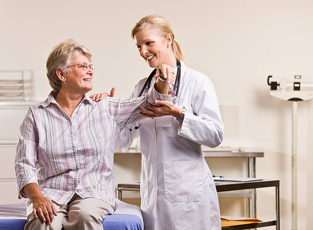 istock Doctor checking senior woman arm 152179909