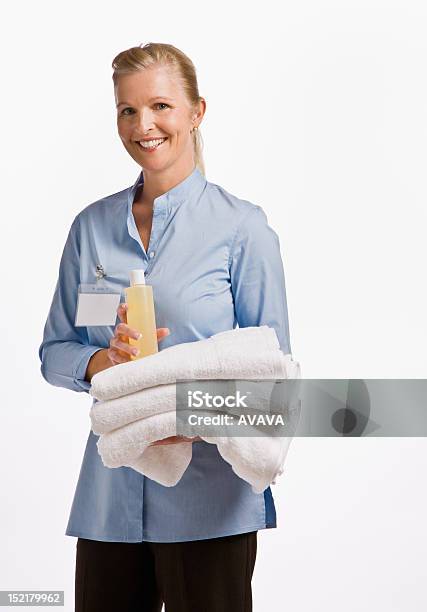 Massage Therapist Holding Oil And Towels Stock Photo - Download Image Now - Adult, Adults Only, Beautiful People