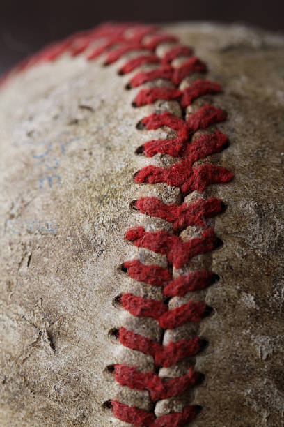 Close up of laces on a worn baseball stock photo