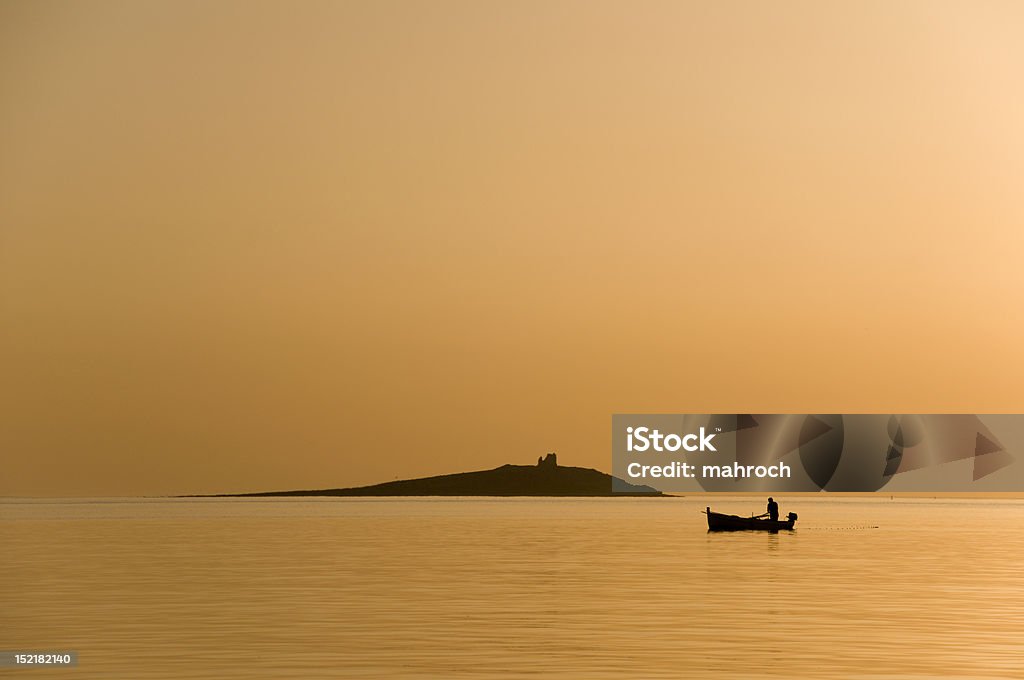 Pêcheur au coucher du soleil - Photo de Adulte libre de droits