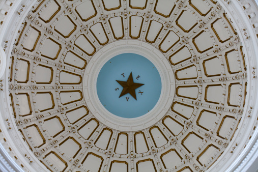 Looking up at the interior dome of the Texas State Capitol in Austin Texas.