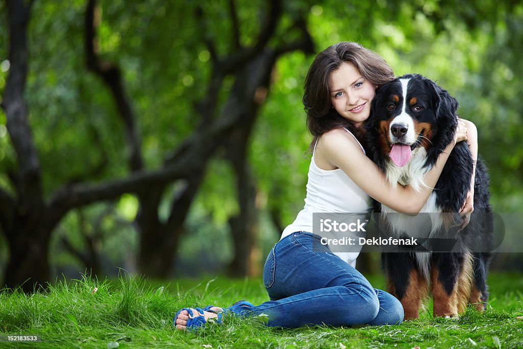 Girl with dog Young girl with a dog in the park Adult Stock Photo