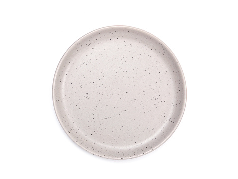 Top view, empty grey round ceramic plate with dotted isolated on a white background. Use for home or restaurant, food design. Kitchen accessory.