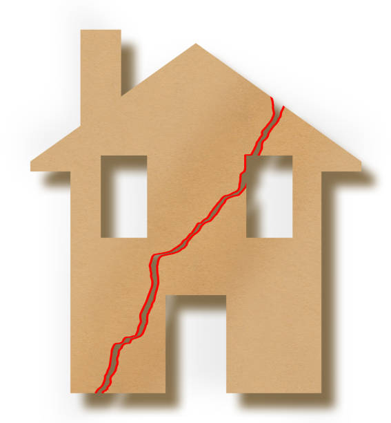 istock Cracked house icon - concept image with a building with a deep crack in the wall 1521878475