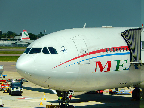 London, England, UK - 14 June 2023: Front of an Airbus A330 passenger jet (registration OD-MEC) operated by MEA Middle Eastern Airways parked at one of the terminals at Heathrow airport.